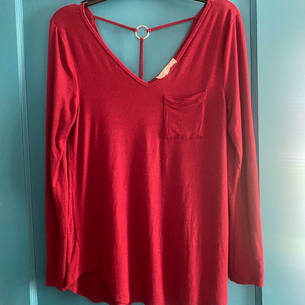Long sleeve top, deep V back with metal ring